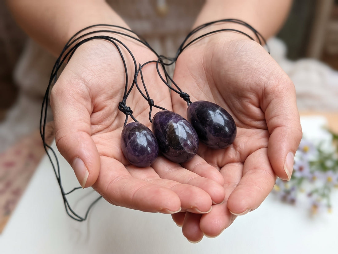 Woman holding in her hands Amethyst Yoni Eggs