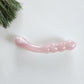 Rose quartz double-ended curved crystal dildo for pleasure and healing