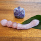 Unique rose quartz crystal dildo with double-ended curved shape