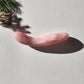 Crystal Wand Yoni with a medium curved shape in a Rose quartz color for the Yoni pleasure