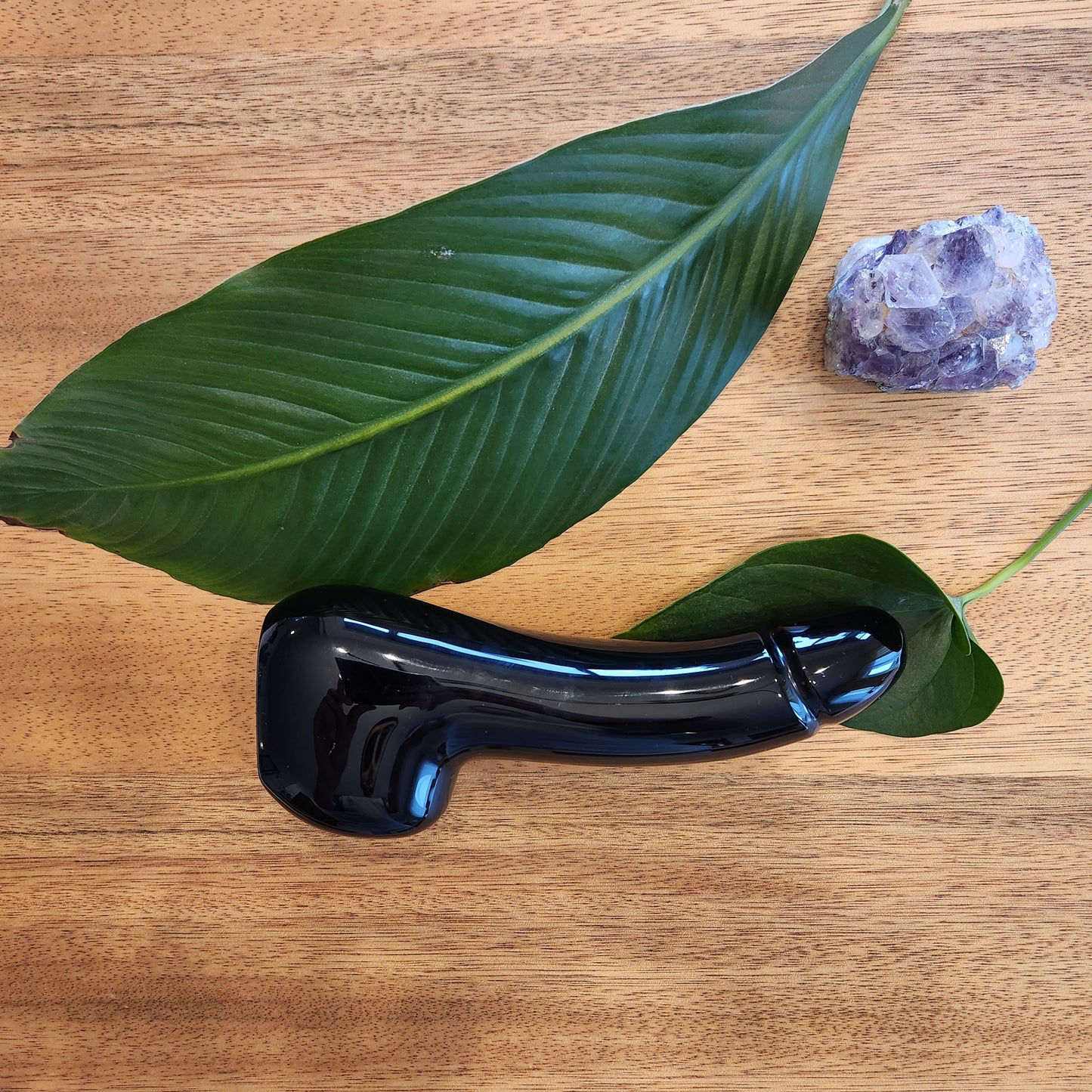 Crystal Wand Yoni in a Penis shape with a Black Obsidian color to reach the G-Spot