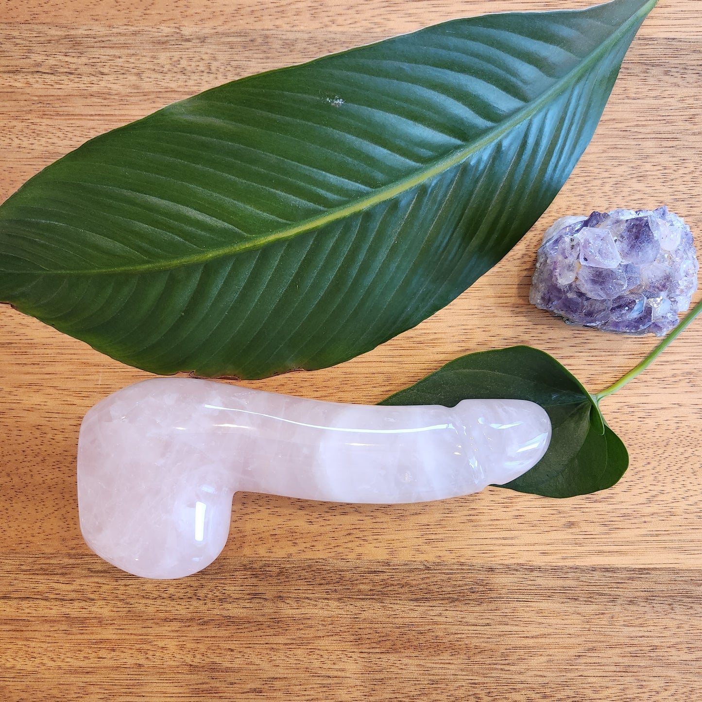 Crystal Wand Yoni in a Penis shape with a Rose Quartz color to reach the G-Spot