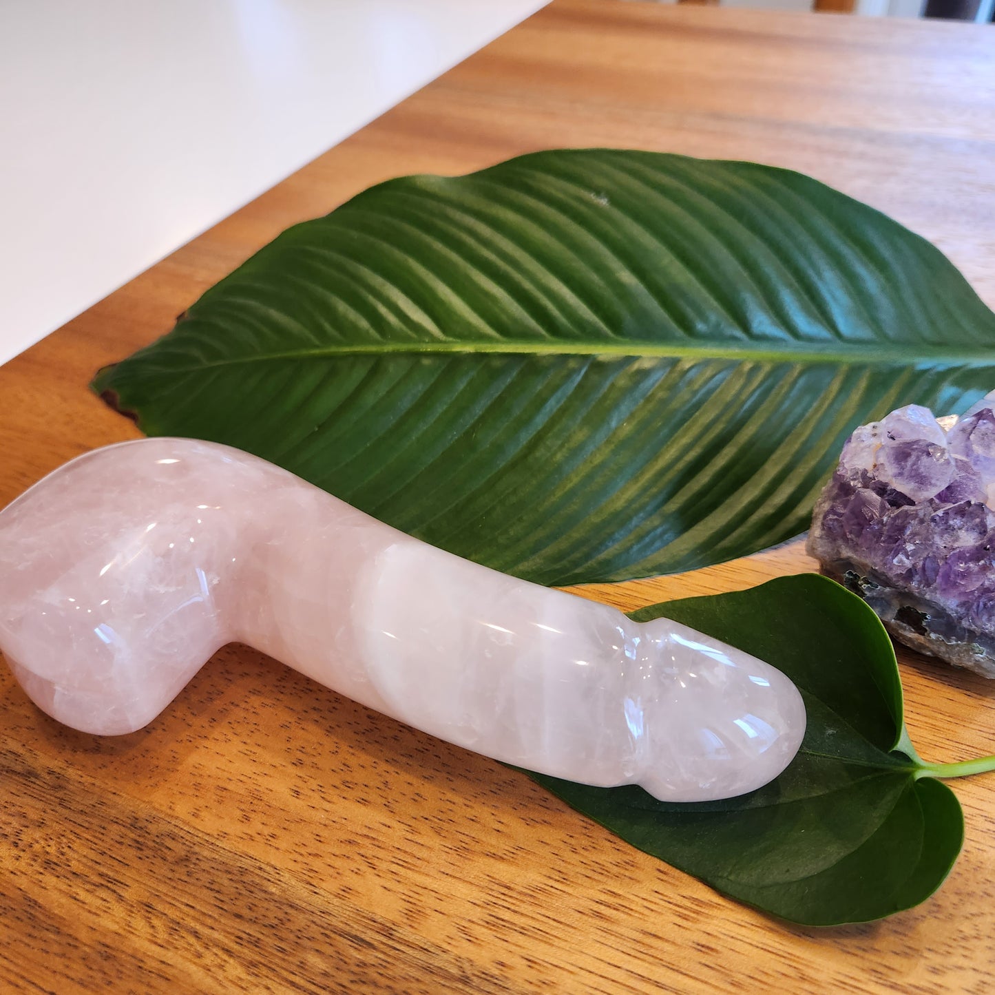 Crystal Wand Yoni in a Penis shape with a Rose Quartz color for amazing sensation