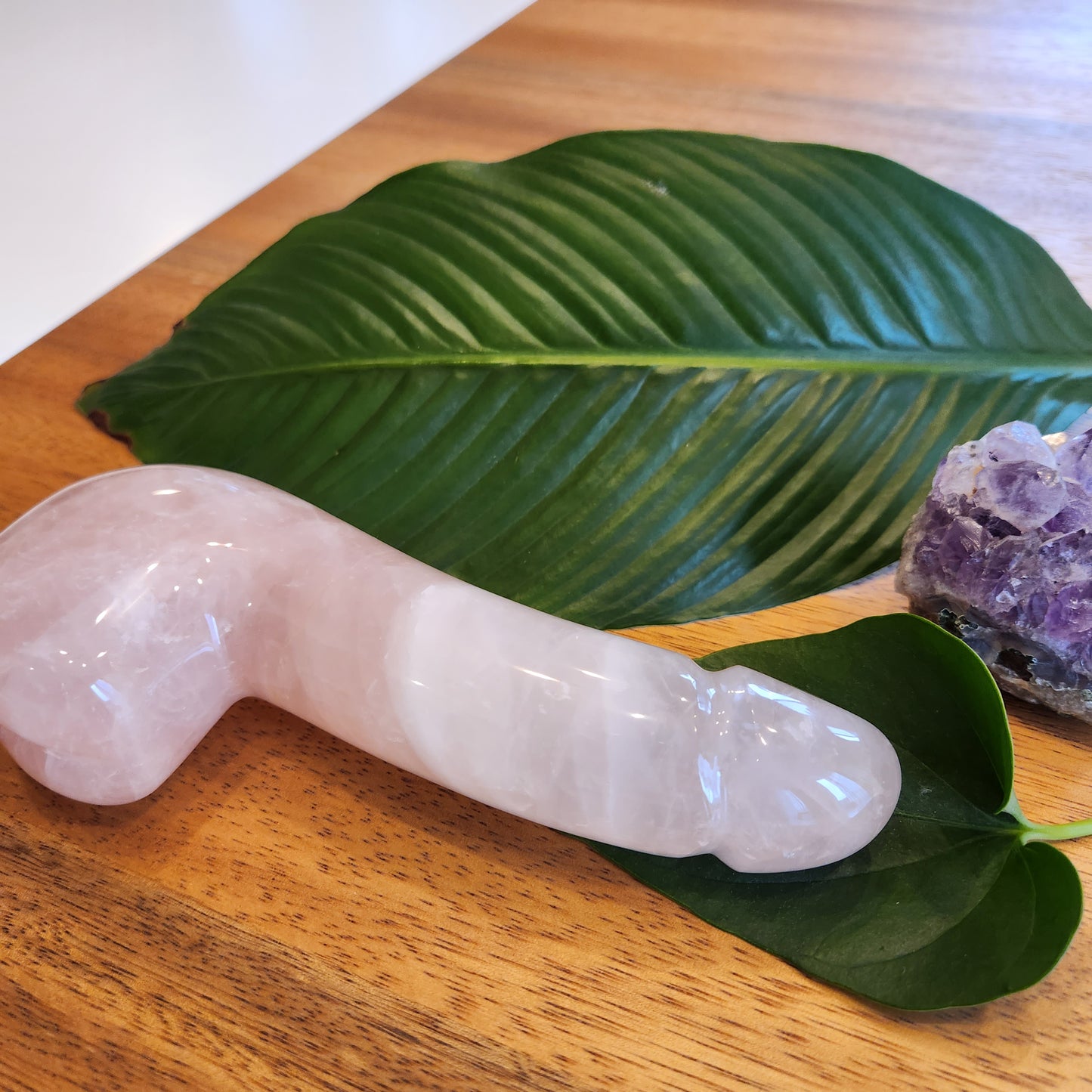 Crystal Wand Yoni in a Penis shape with a Rose Quartz color for sex anal