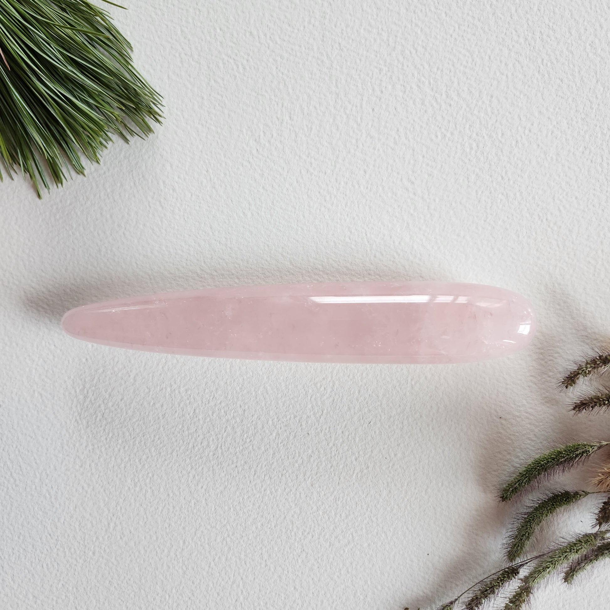 Crystal Wand Yoni in a slim straight shape in a Rose Quartz color to reach the G-Spot