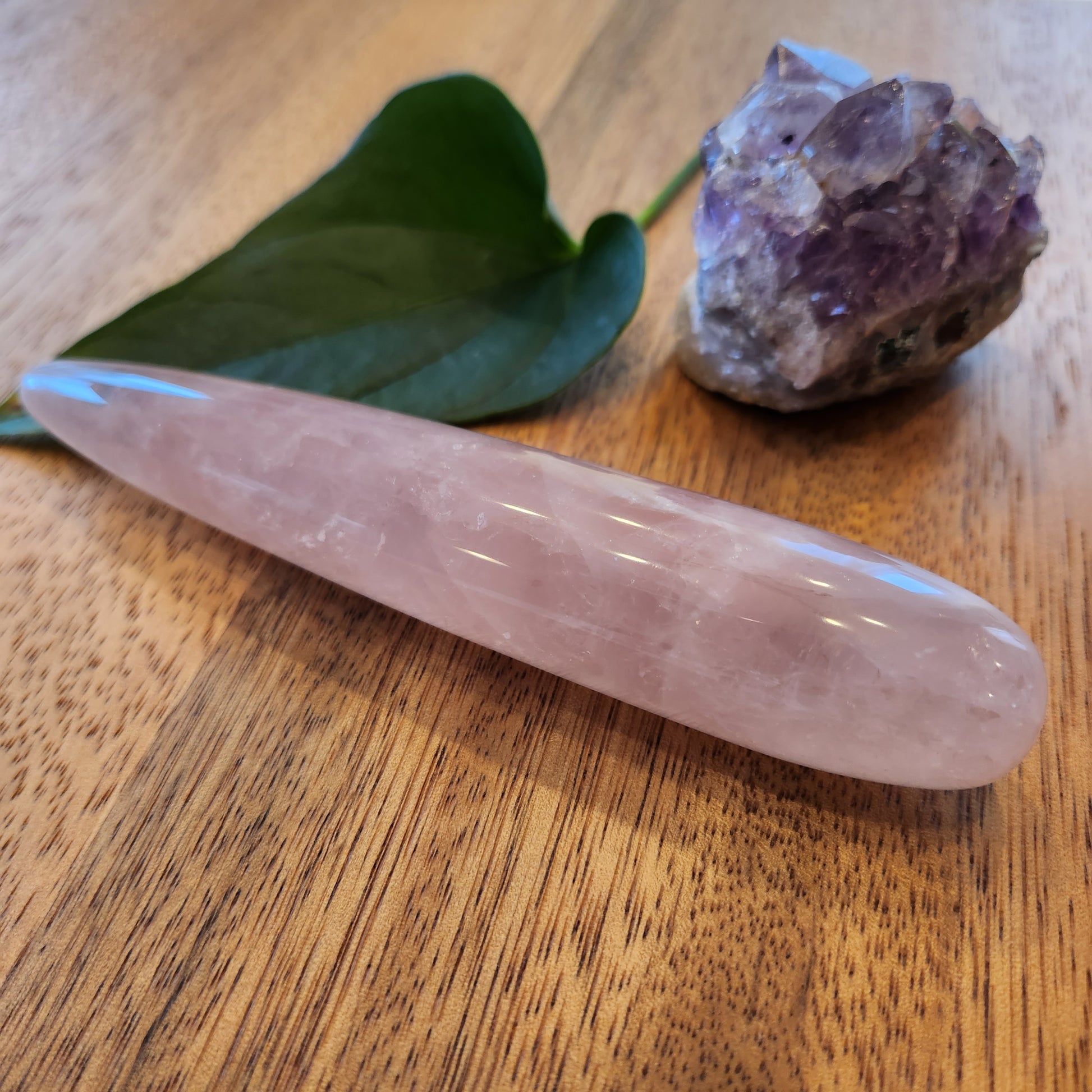 Crystal Wand Yoni in a slim straight shape in a Rose Quartz color for amazing pleasure