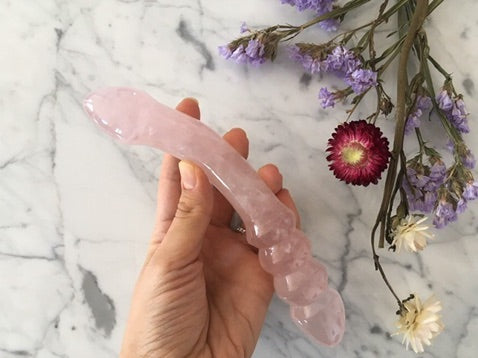 Unique rose quartz crystal dildo with double-ended curved shape for anal